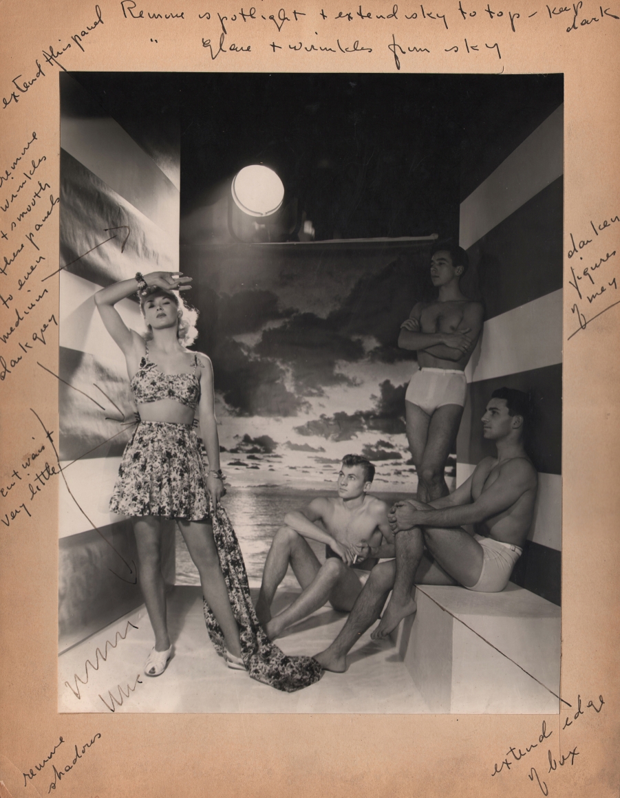 George Platt Lynes, Swimsuit Advertising, ​c. 1950. One female and three male models pose in swimsuits in a studio with a seascape backdrop. The artist's handwritten notes surround the print.
