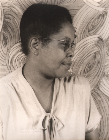 06. Carl Van Vechten, Bertha "Chippie" Hill, ​1947. Bust-length portrait with the subject's head in profile, facing the right of the frame.