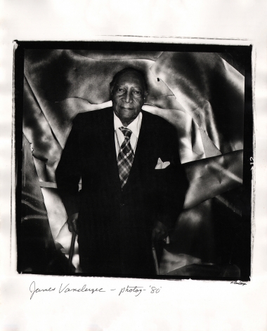 Anthony Barboza, James Van Der Zee - Photographer, 1980. Subject stands in the center of the square frame supported by two wooden canes against a shiny and textured backdrop.