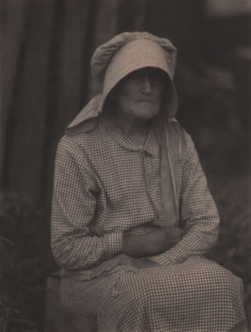 Doris Ulmann, Untitled (Woman in bonnet), ​1928–1934. Seated woman in checkered dress and large bonnet with arms crossed
