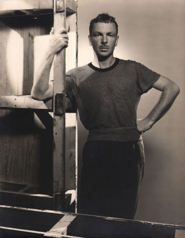 George Platt Lynes, Jared French, c. 1946. Subject stands behind and beside wooden supports.