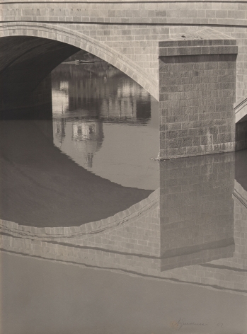 Alberto Galducci, Untitled, ​1952. Detail of an arched bridge and its reflection on a still body of water.