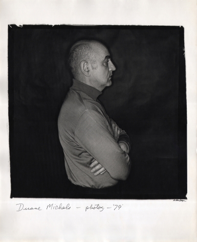 Anthony Barboza, Duane Michals - Photographer, ​1979. Subject stands in profile facing right in the center of the square frame with arms crossed.